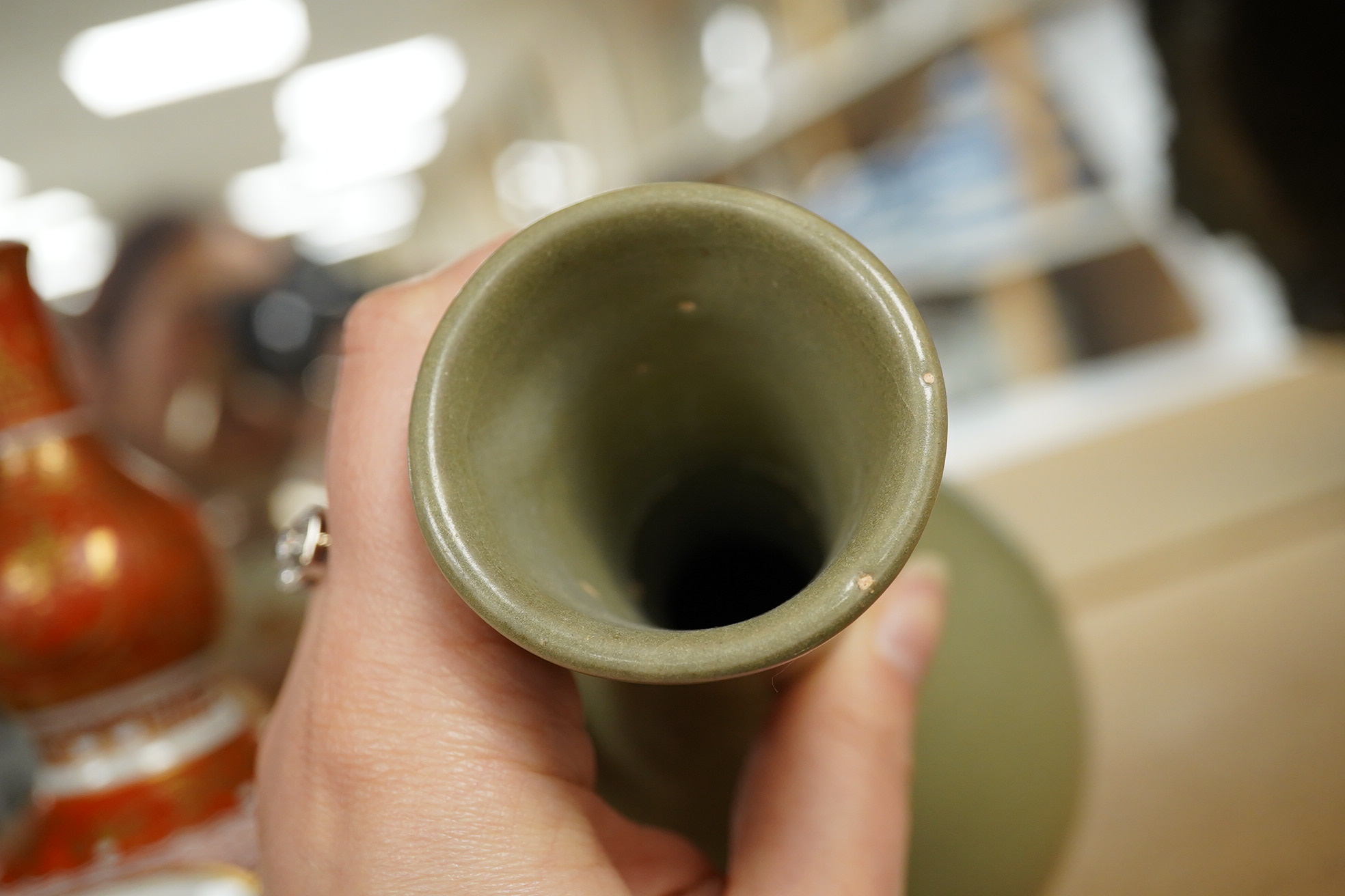 A Chinese celadon crackle glazed vase and a Japanese Kutani vase, tallest 22cm. Condition - good